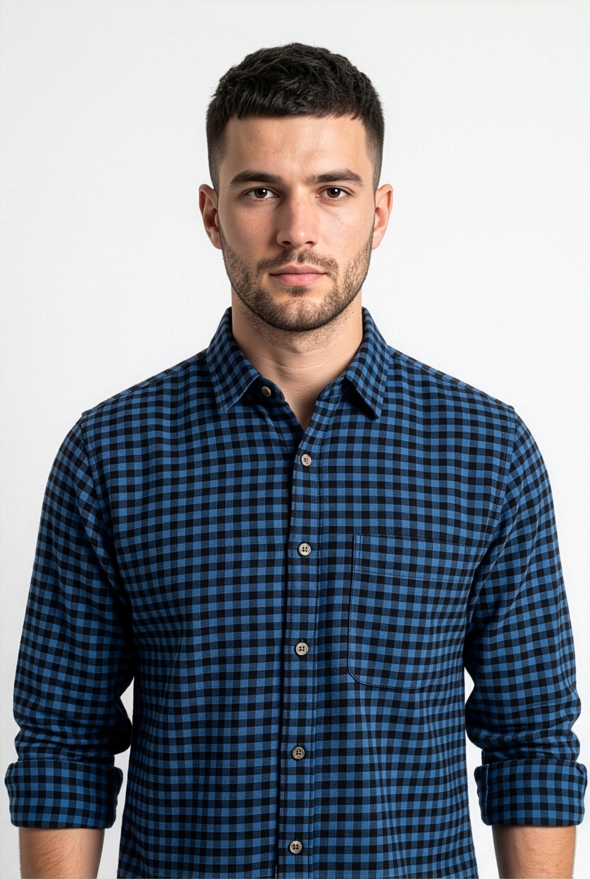 Collar and chest pocket detail of blue and black gingham flannel shirt