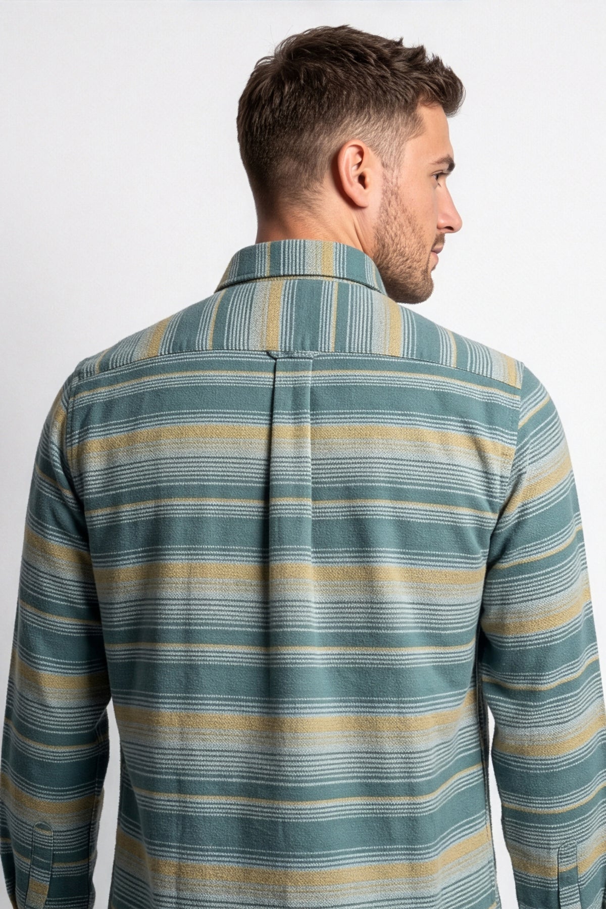 Back yoke and centre pleat detail of teal and beige striped flannel shirt