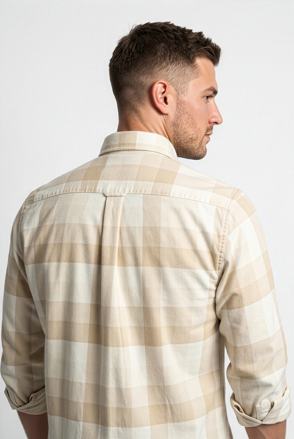 Back yoke and centre pleat detail of cream and beige check flannel shirt