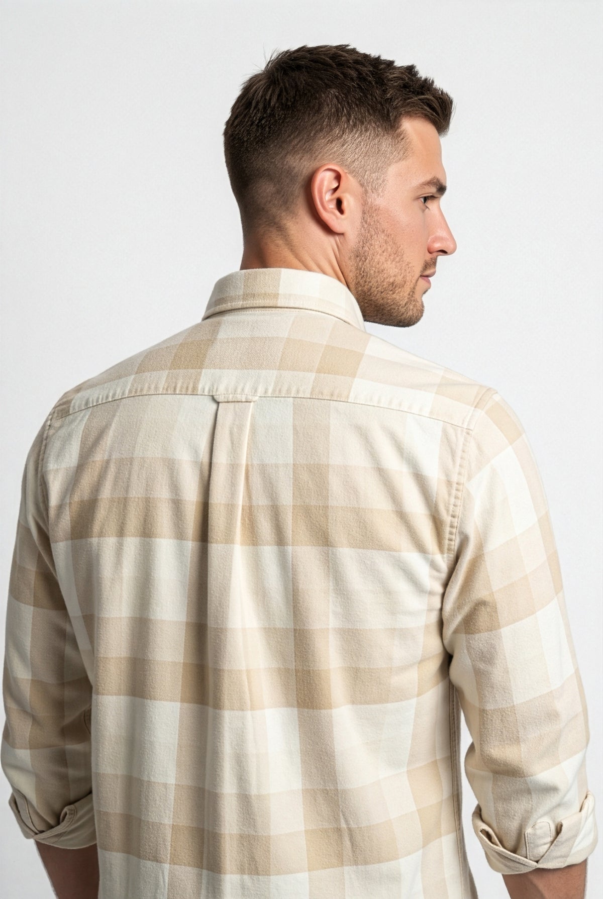 Back yoke and centre pleat detail of cream and beige check flannel shirt