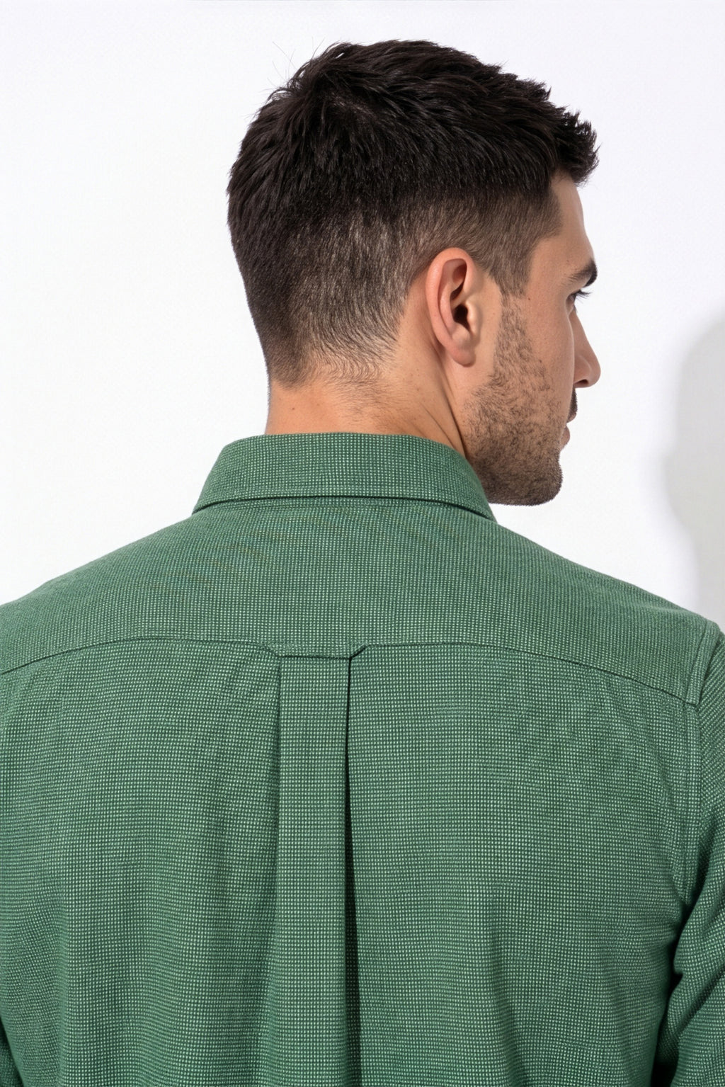 Back yoke and centre pleat detail of green micro-check flannel shirt