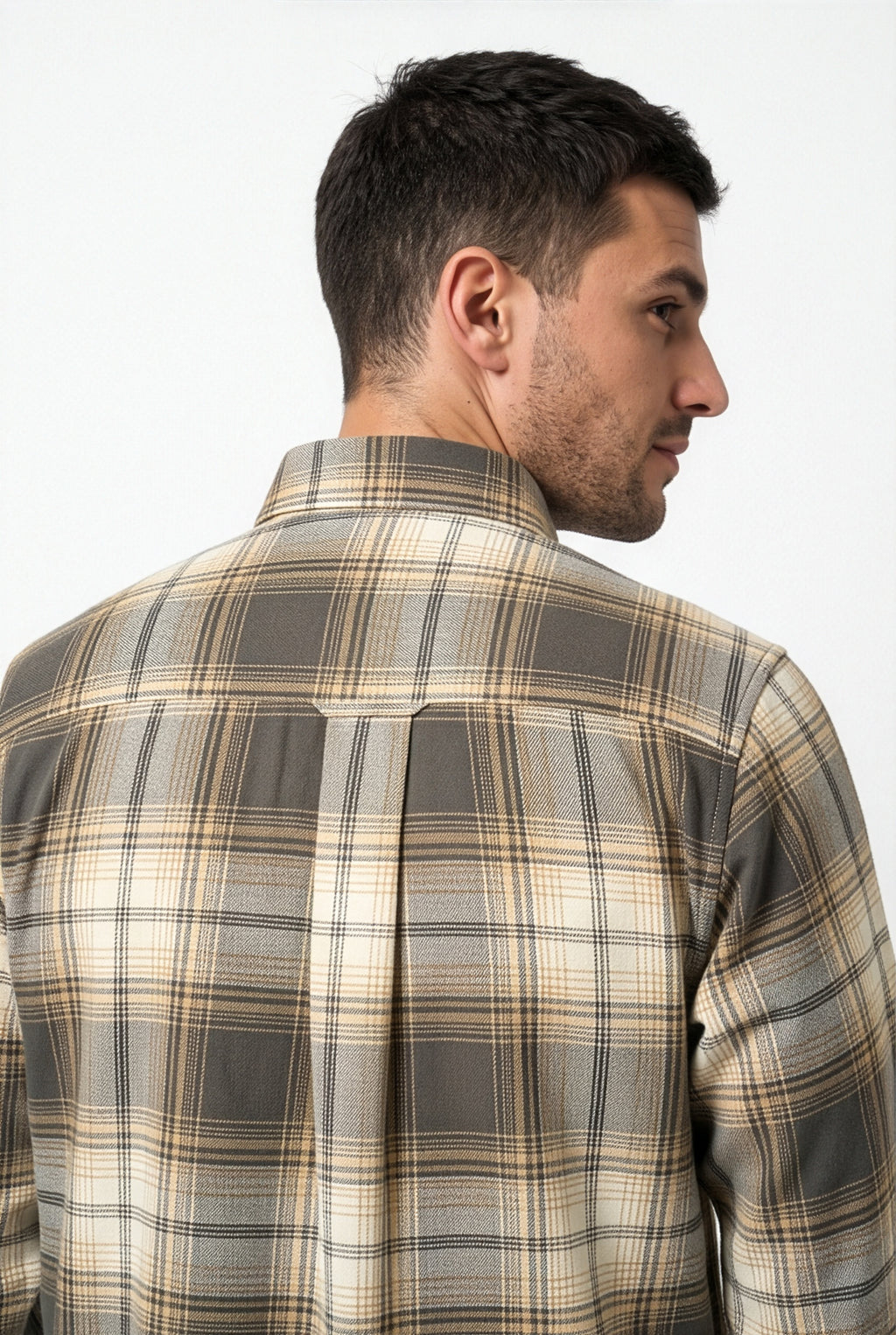 Back yoke and centre pleat detail of grey and beige plaid flannel shirt