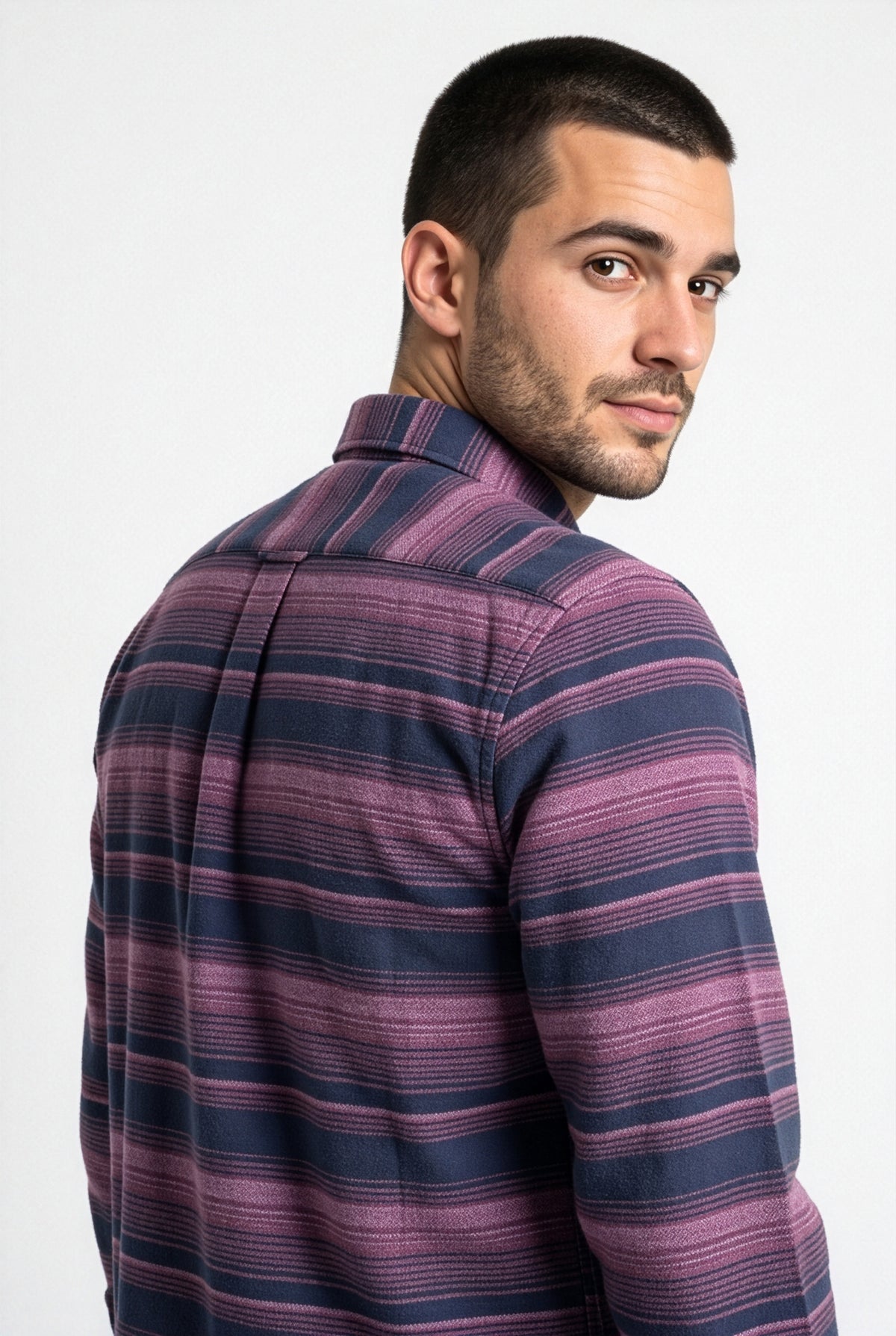 Back yoke and centre pleat detail of navy and purple striped flannel shirt