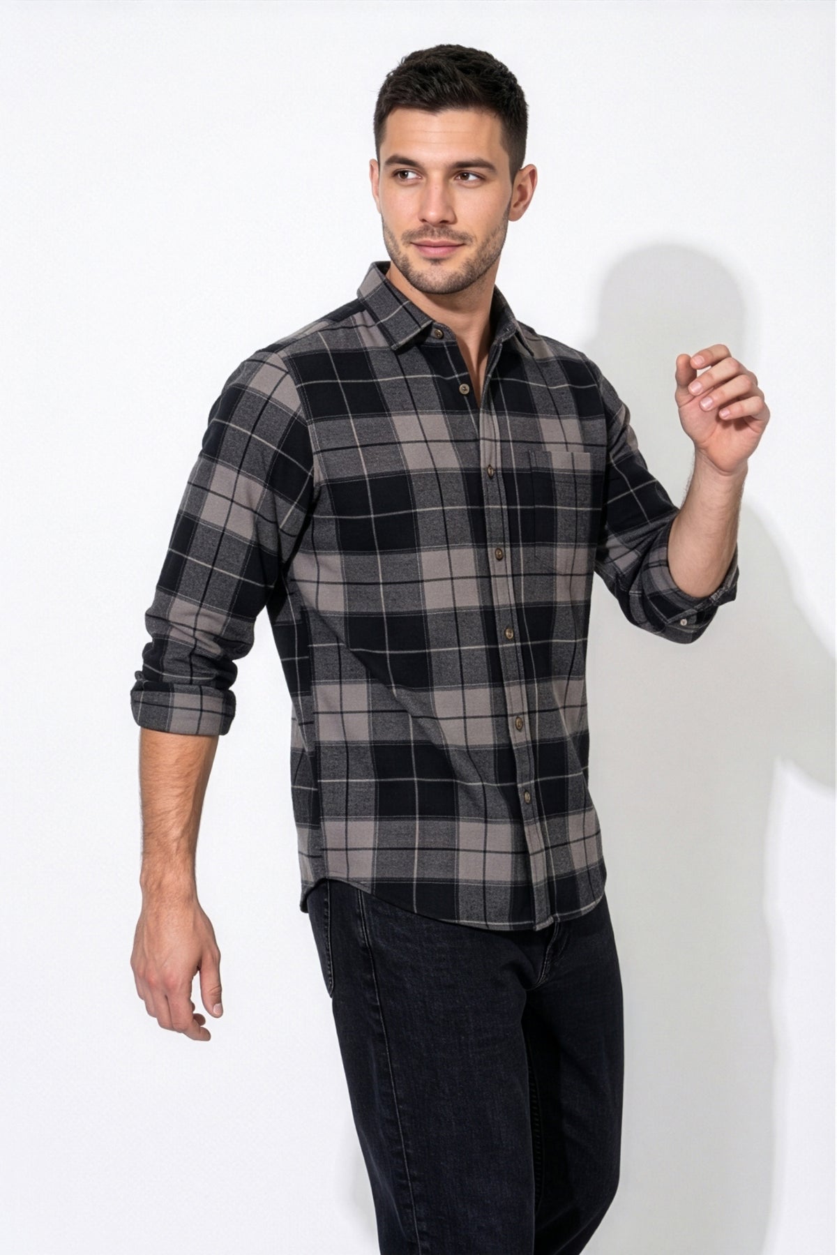 Three-quarter front view of men's black and grey plaid flannel shirt