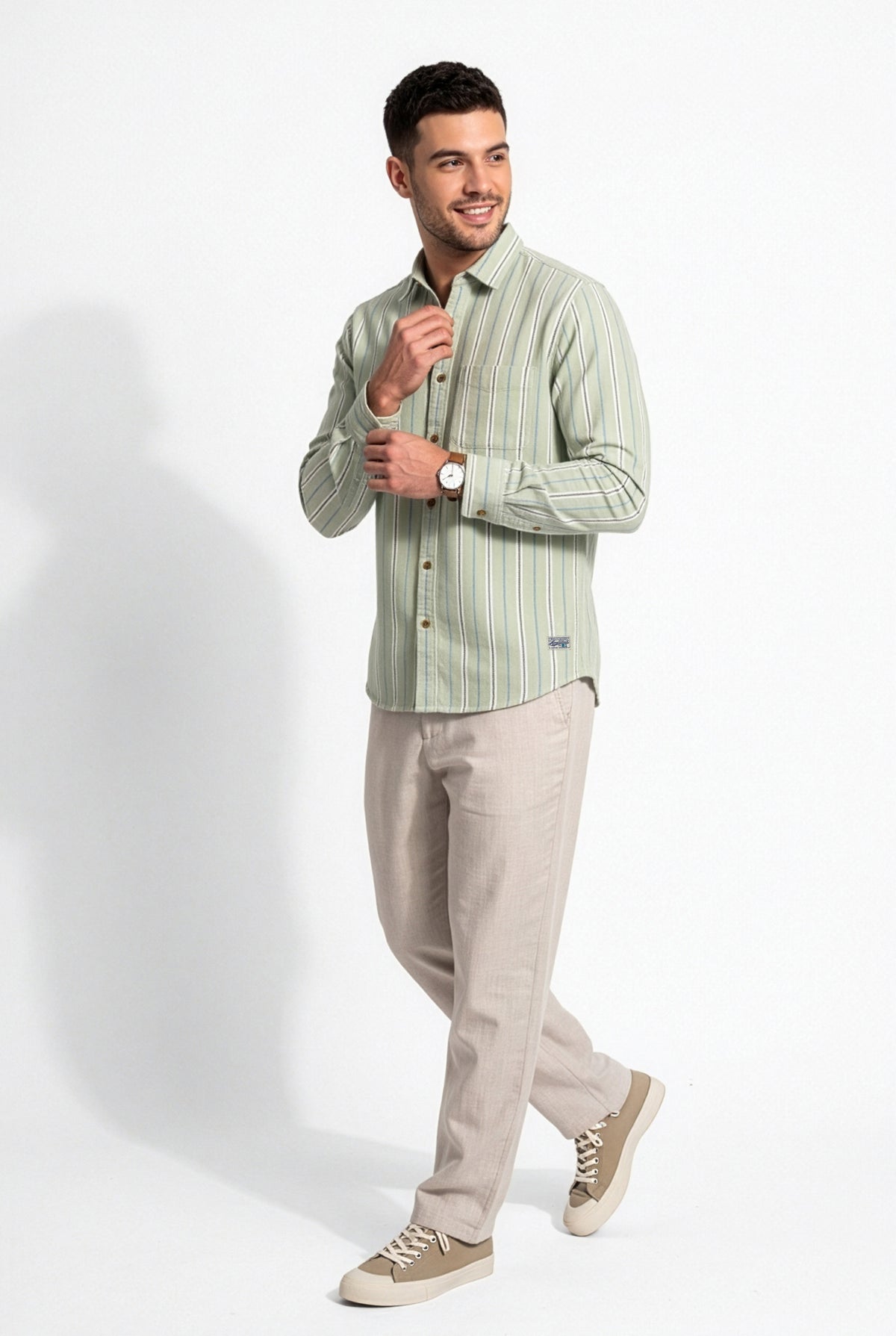 Three-quarter front view of men's sage green striped cotton dobby shirt