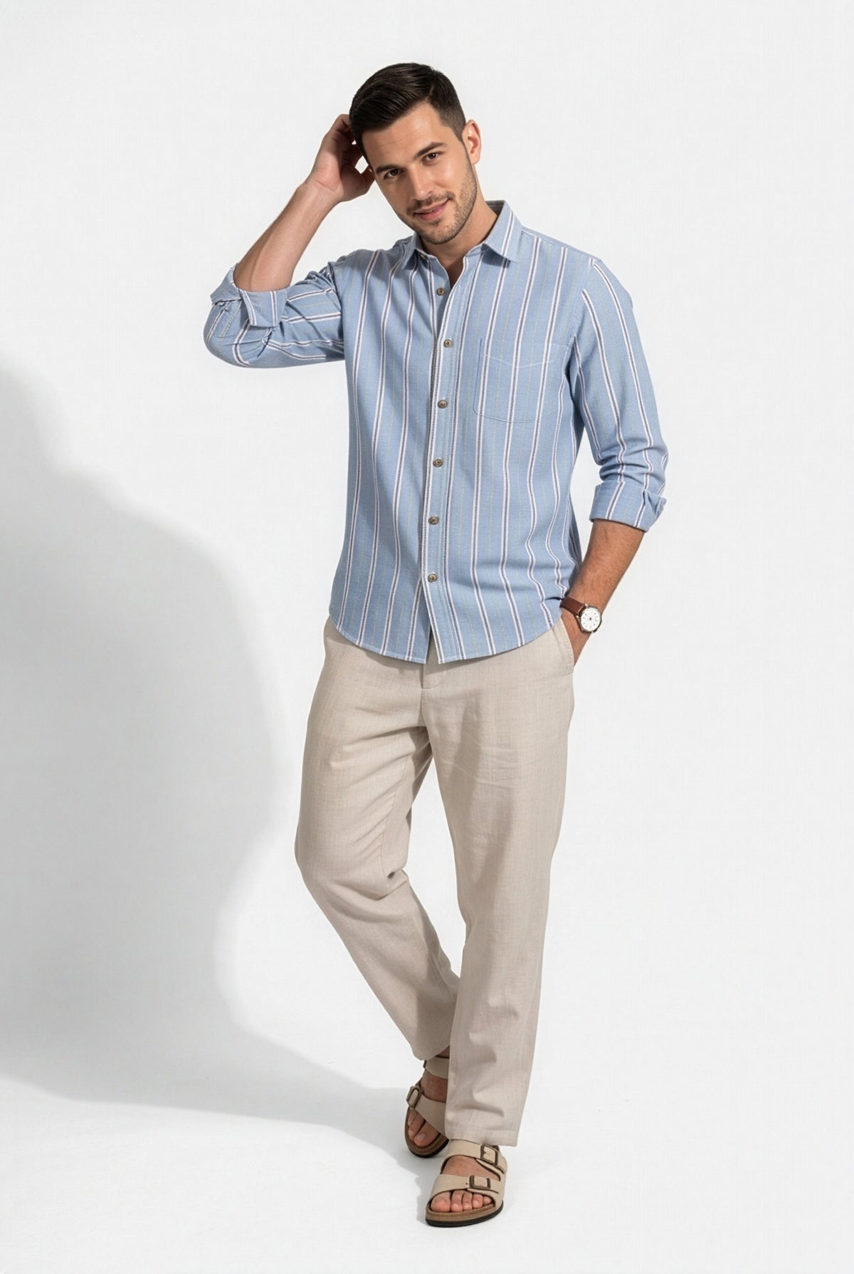 Three-quarter front view of men's light blue striped cotton dobby shirt