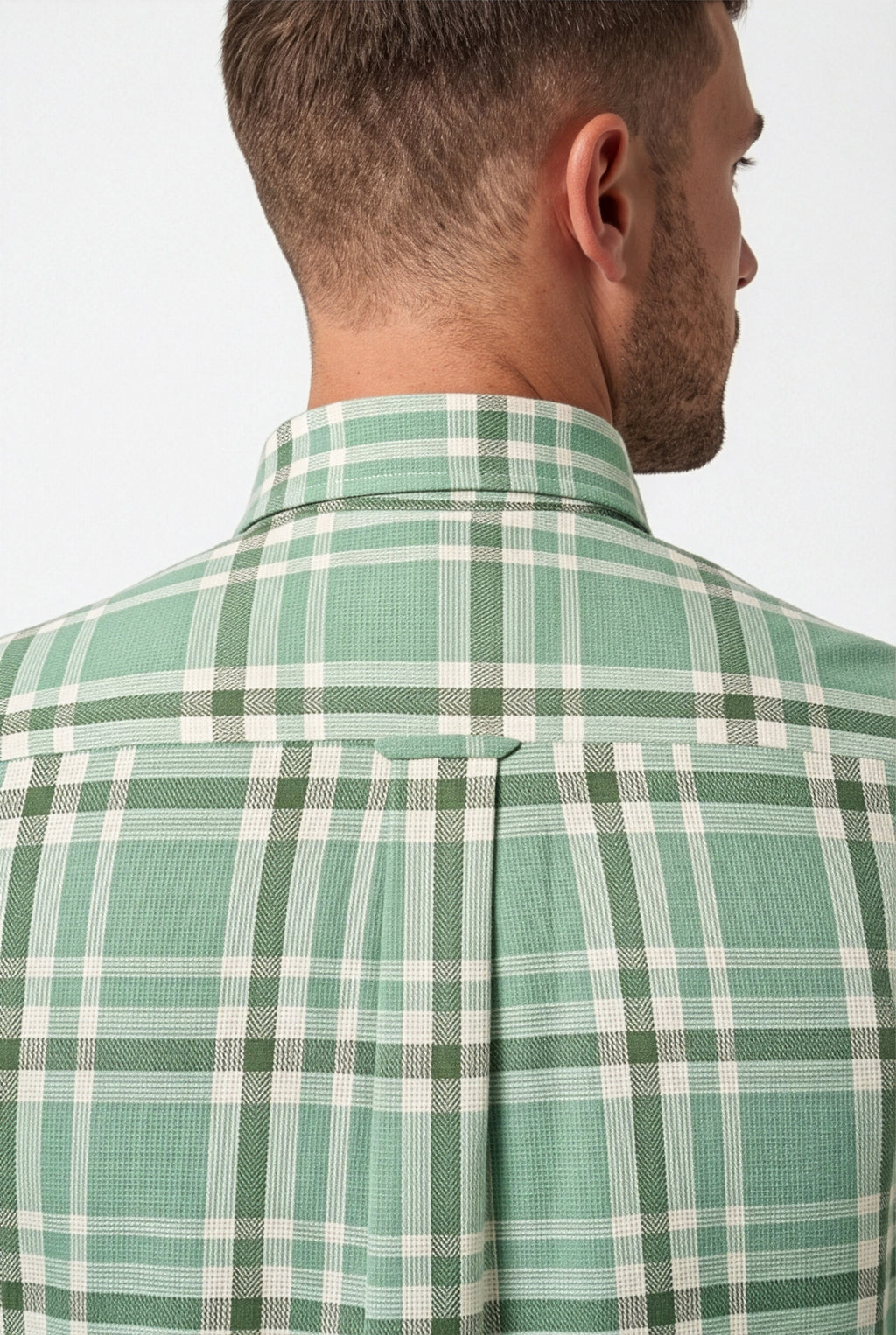 Back yoke and centre pleat detail of mint green and cream plaid cotton dobby shirt