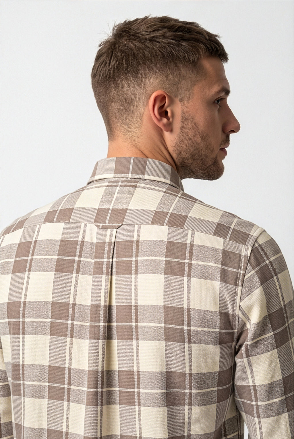 Back yoke and centre pleat detail of taupe and cream large-check cotton dobby shirt