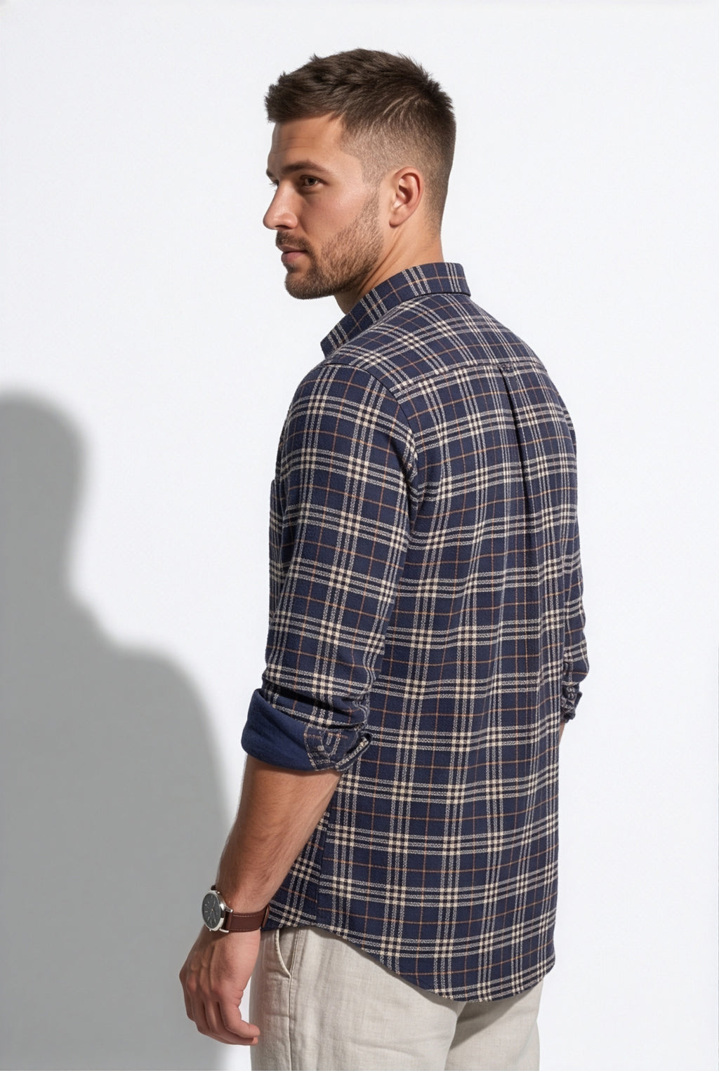 Full-length front view of men's navy and cream plaid cotton dobby shirt