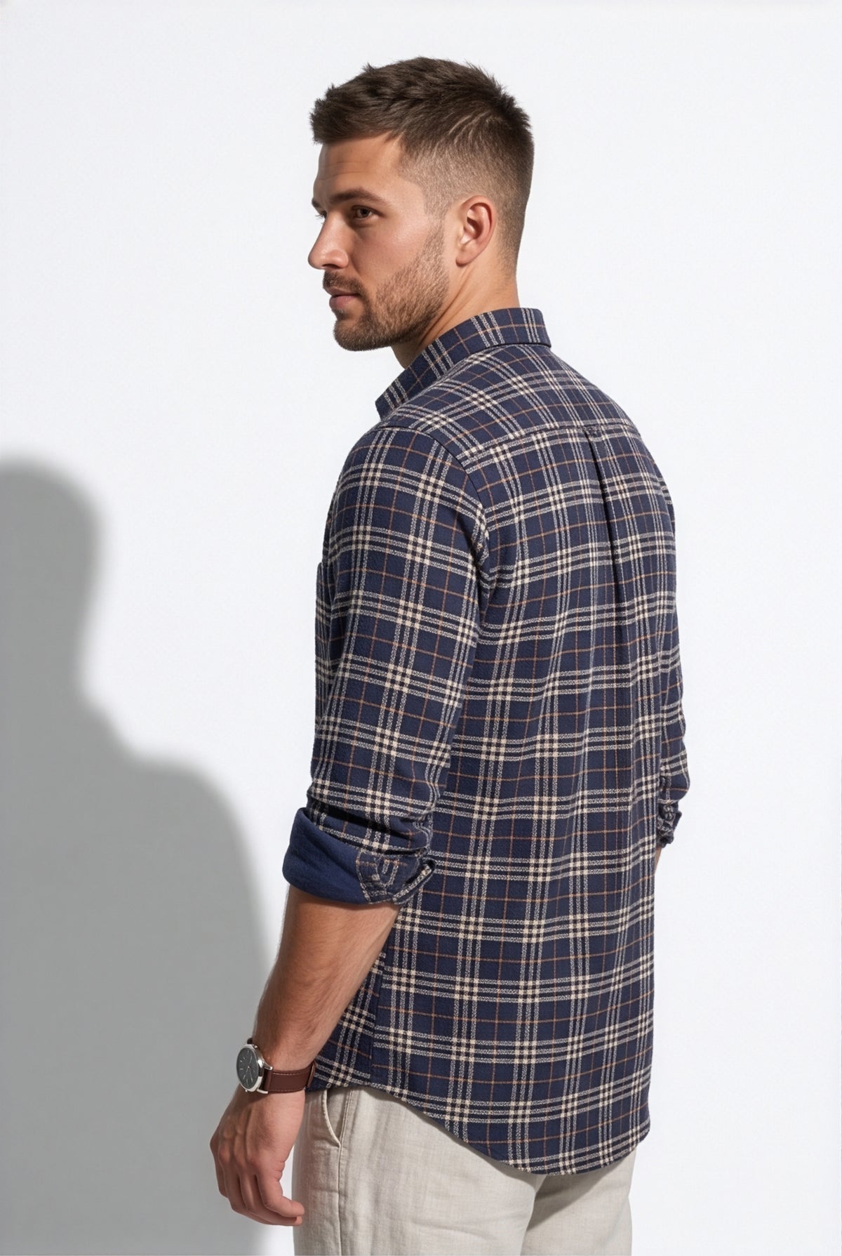 Full-length front view of men's navy and cream plaid cotton dobby shirt