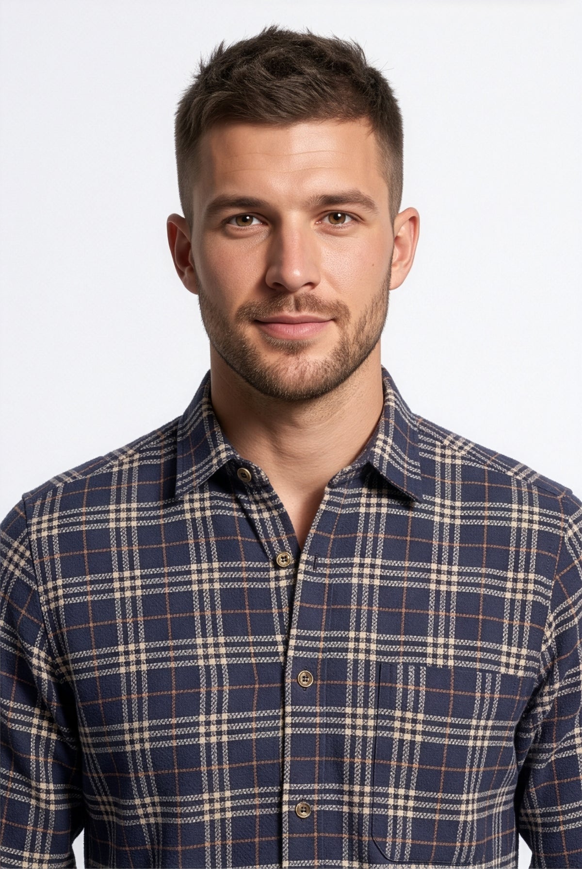 Collar and chest pocket detail of navy and cream plaid cotton dobby shirt