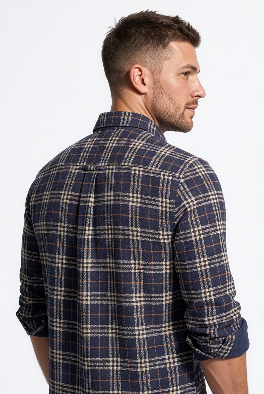 Back yoke and centre pleat detail of navy and cream plaid cotton dobby shirt