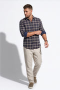 Rear three-quarter view of men's navy and cream plaid cotton dobby shirt