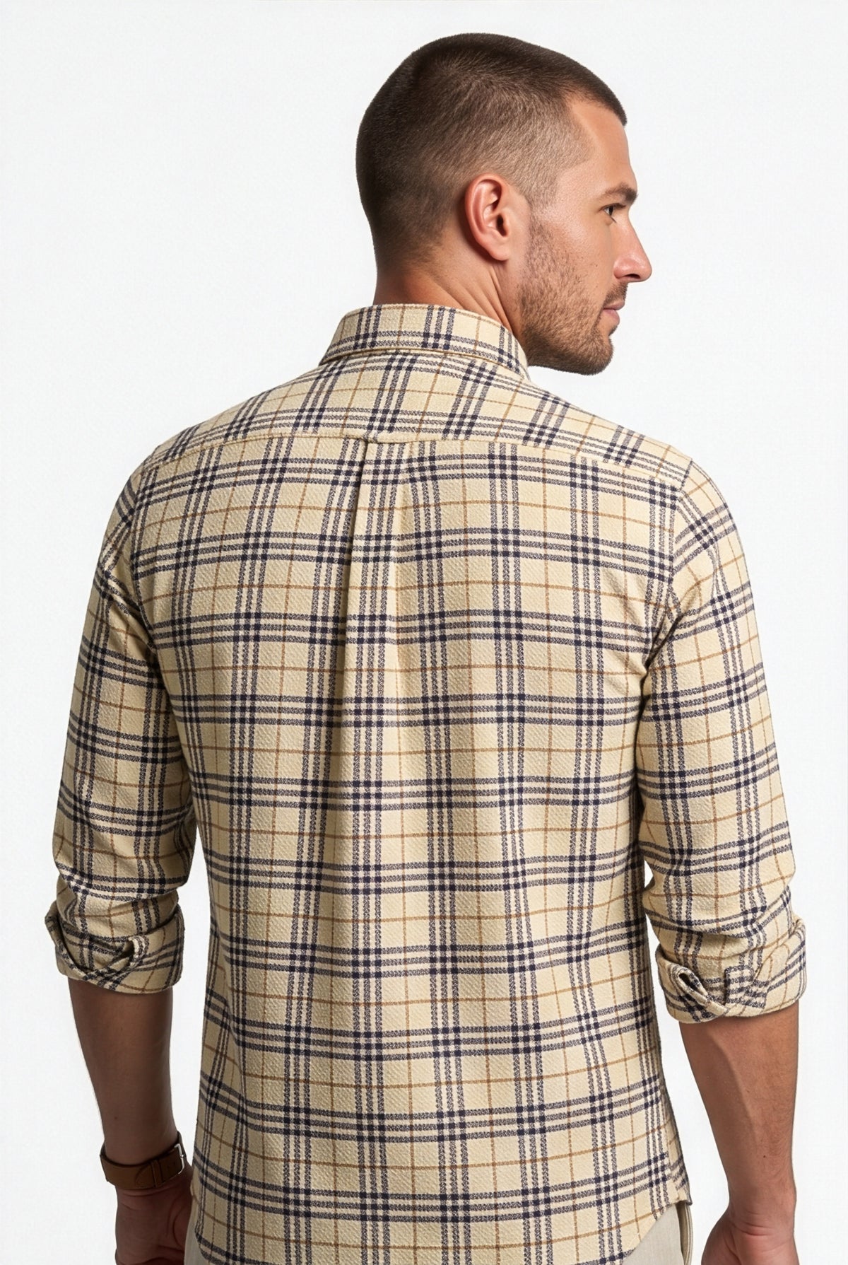 Back yoke and centre pleat detail of beige and black plaid cotton dobby shirt