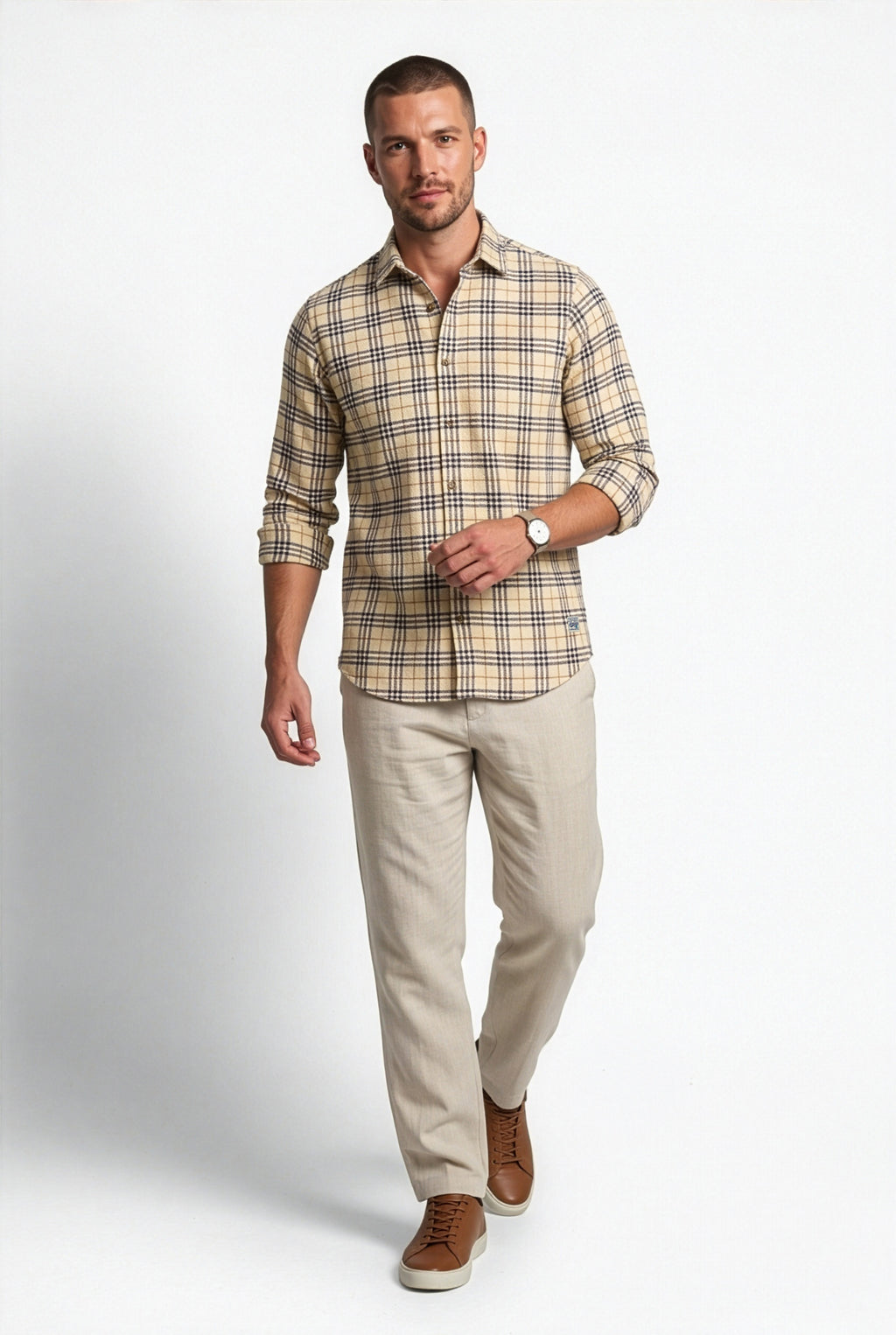 Three-quarter front view of men's beige and black plaid cotton dobby shirt