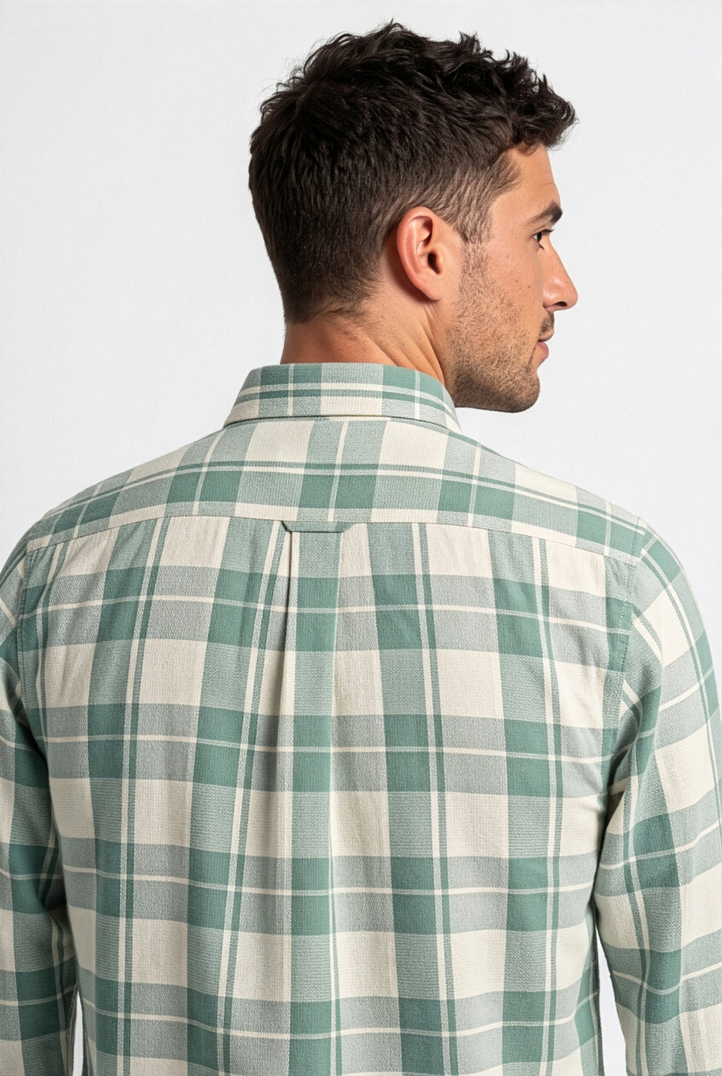 Back yoke and centre pleat detail of sage green and cream plaid cotton dobby shirt