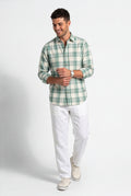 Three-quarter front view of men's sage green and cream plaid cotton dobby shirt